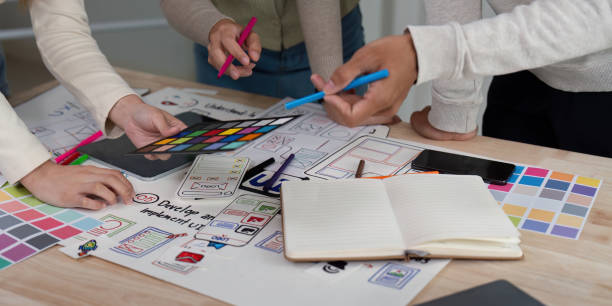 istock Brainstorm team of creative web graphic designer planning. Creative designers present ux ui to team. Designers team working meeting in office 2149059337