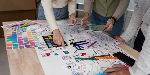 istock Brainstorm team of creative web graphic designer planning. Creative designers present ux ui to team. Designers team working meeting in office 2149059357
