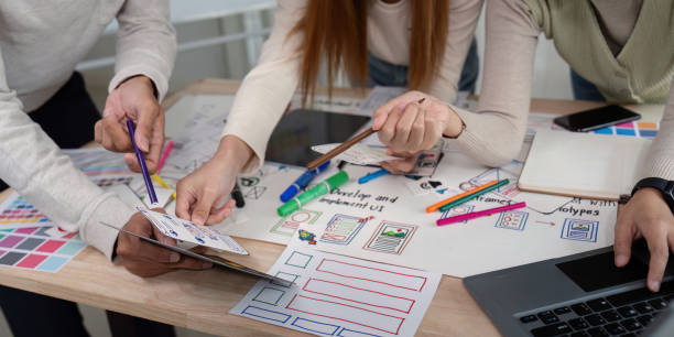 istock Brainstorm team of creative web graphic designer planning, Group of mobile phone app developer team meeting for share ideas about screen prototype layout for smartphone. startup planning ui and ux 2149060565