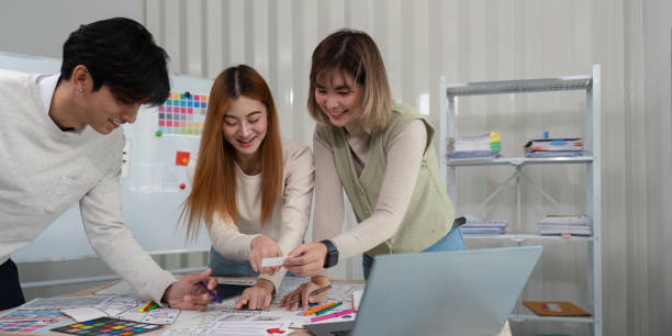 istock Brainstorm team of creative web graphic designer planning. Creative designers present ux ui to team. Designers team working meeting in office 2149060576