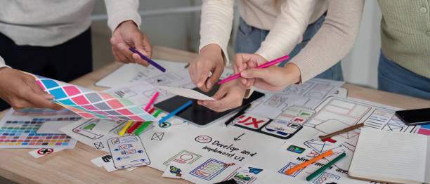 istock Brainstorm team of creative web graphic designer planning, Group of mobile phone app developer team meeting for share ideas about screen prototype layout for smartphone. startup planning ui and ux 2149060584