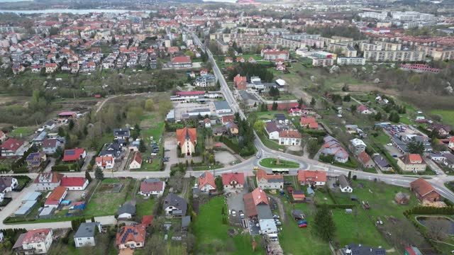 Drone view of a small town with a church on the outskirts