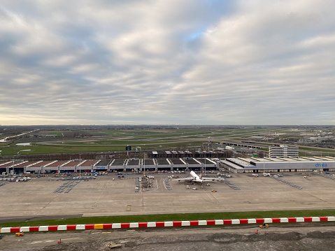 Aerial view of Schiphol airport terminal  in Holland from a jet plane window