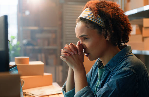 istock Stress, computer or woman with boxes for shipping mistake, inventory crisis or delivery risk. Scared, anxiety or nervous logistics officer in factory for wholesale distribution, production or import 2149061298