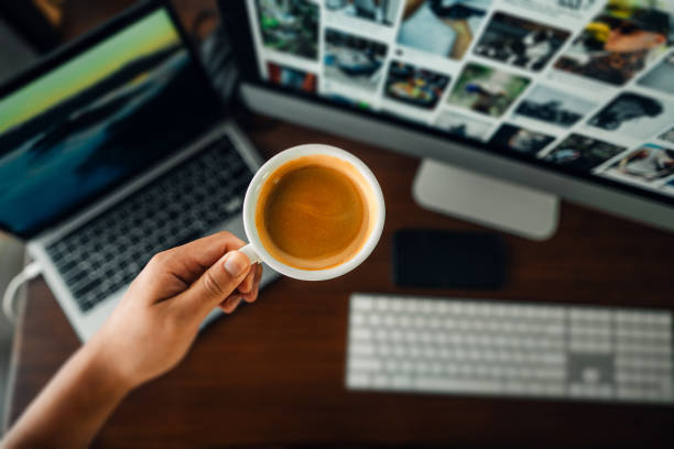 Hand holding coffee in the morning