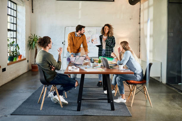 istock Young happy creative team having a meeting at casual office. 2149064791