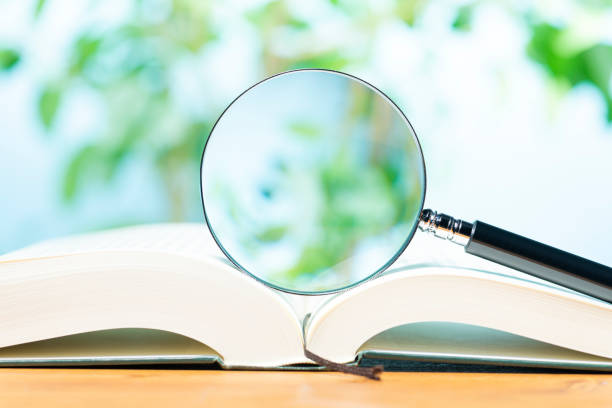 istock A Book and Magnifying Glass on the Table 2149065668