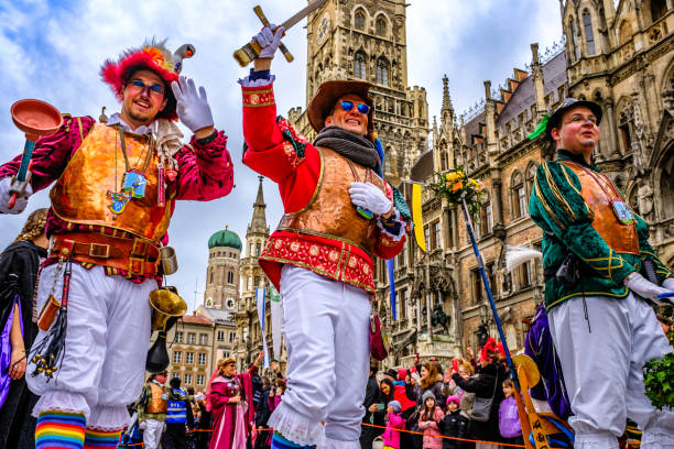 Munich, Germany - February 4: Disguised participants in the annual carnival parade of the “Damic Knights” at the old town in Munich on february 4, 2024