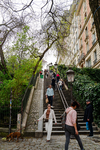 Paris, France - April 6th, 2024: The stairs leading to The Basilica Sacre Coeur of the Sacred Heart of Paris, France