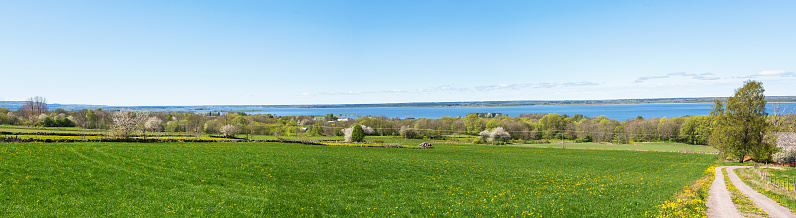 Panoramic view of rural landscape with a lake