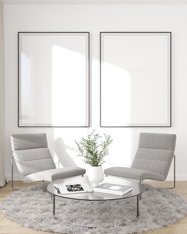 Two minimal black photo frames mockup on the white wall in the living room with two gray armchairs and a coffee table with books on the carpet, 3D illustration.