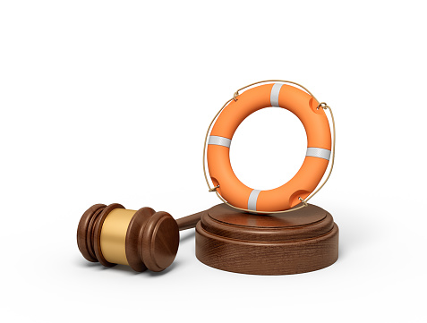 3d rendering of orange lifebuoy on sounding block with gavel lying beside. Just trial. Save life. Auction lots.