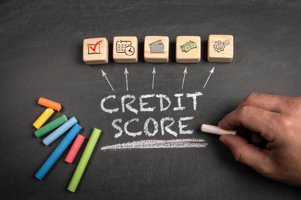 istock Credit Score. Wooden blocks on a dark chalkboard background 2149069162