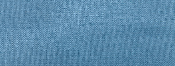 istock Texture of light blue color background from textile material with wicker pattern, macro. Vintage denim fabric 2149069790