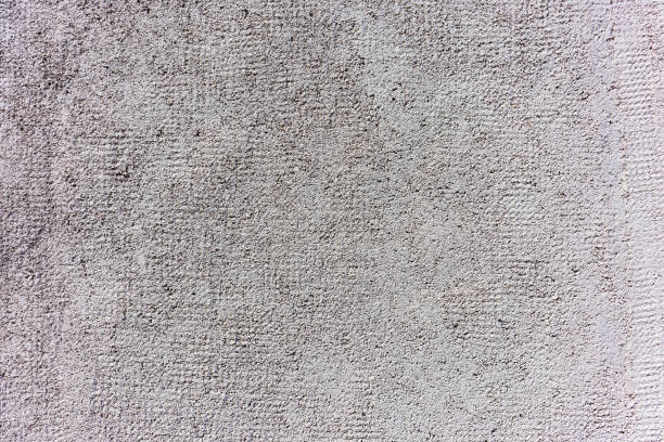 Plastered gray wall abstract texture background close up