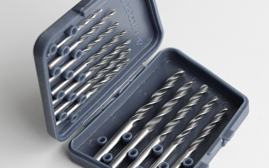 Variety size drill bits in plastic box with indicating the drill diameter in millimeters