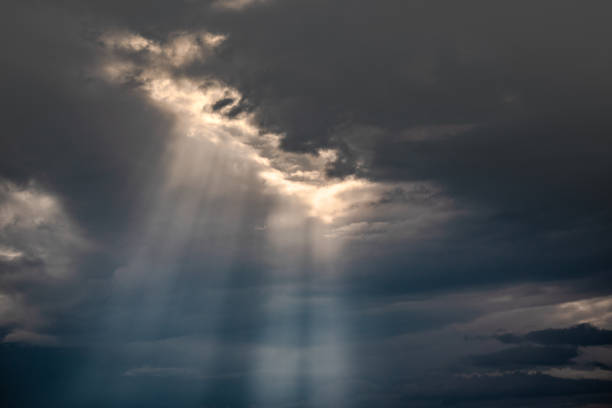 A pillar of sunlight in a stormy sky