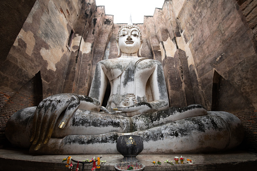 White buddha statue at Sri Chum temple in Sukhothai Historical Park, Sukothai Thailand