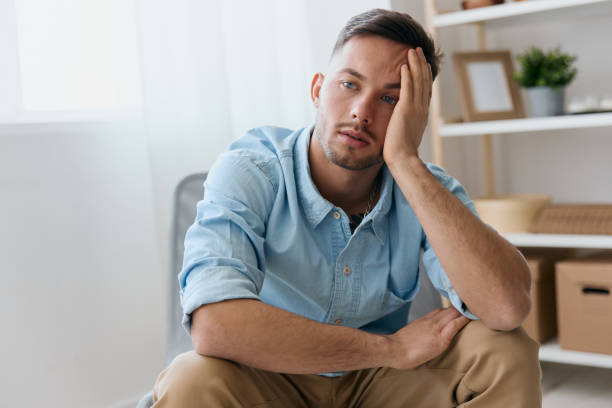 istock Sad frustrated young man reclines on hand looks aside think about difficult life decision bad news health problem. Upset guy have depression need professional psychology help. Copy space for ad 2149072165