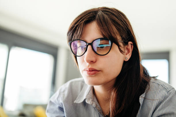 istock Close-up of woman using laptop for work at home. 2149073211