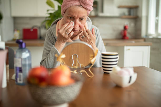 istock Senior woman removing make up 2149074691