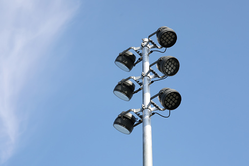 Street light with white cloud on blue sky background