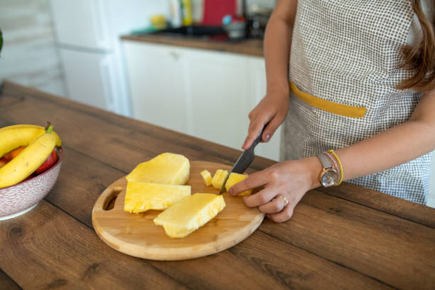 istock Unrecognizable woman preparing fruit salad for herself 2149074969