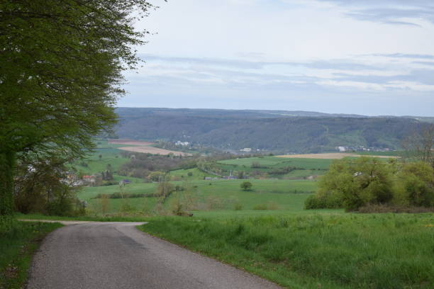 istock farm road into a wide valley 2149075370