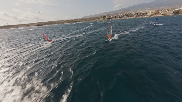 FPV drone flight. View of Wind and Kite Surfers at El Medano, Tenerife