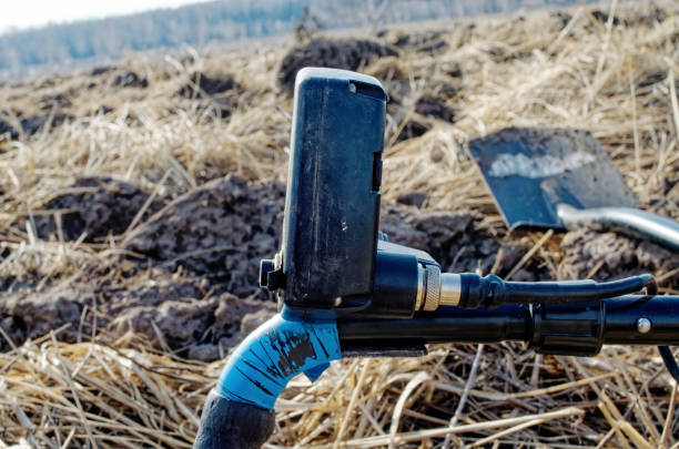 istock Metal detector lying in the field 2149076212