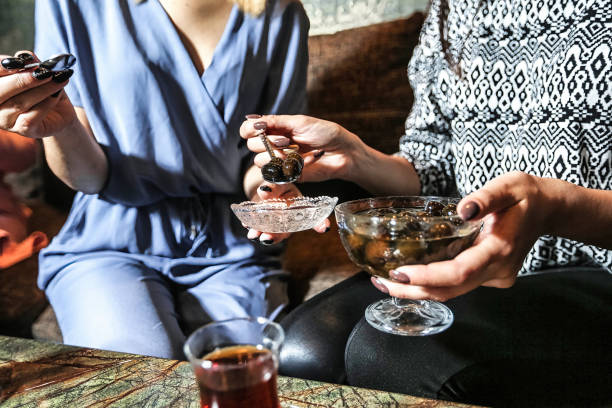 istock Group of People Sitting Around a Table With Drinks 2149076945