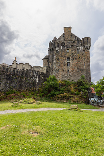 Dornie - United Kingdom. May 22, 2023: Vertically framed, this photo highlights the impressive Eilean Donan Castle, with its historic walls and turrets standing proudly