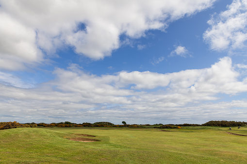 St Andrews - United Kingdom. May 27, 2023: The timeless elegance of The St Andrews golf course is captured in this image, featuring wide fairways and natural hazards and bunkers
