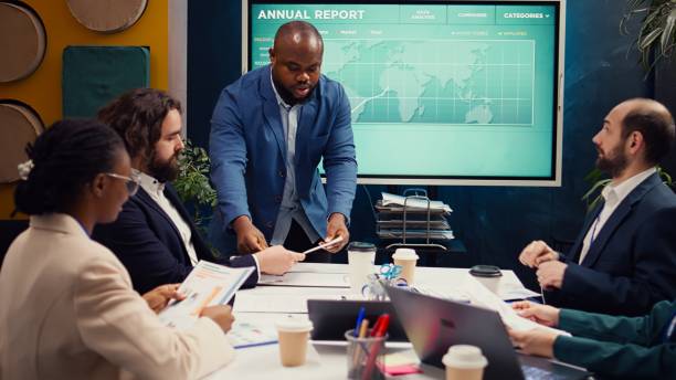 istock Project manager meeting with his executive team in a boardroom office 2149077493