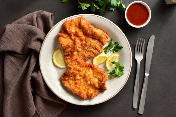 istock Schnitzel with lemon and leaves of parsley 2149077908