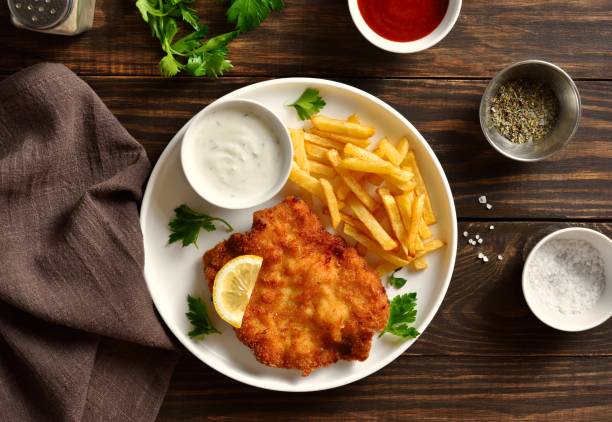 istock Weiner schnitzel with potato fries. Top view, flat lay 2149077909