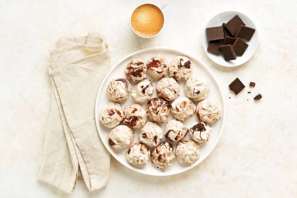 istock Chocolate meringue cookies and cup of coffee 2149078546
