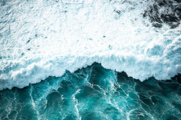 istock Ocean waves crashing, top down aerial drone view. Storm on sea or ocean 2149079541