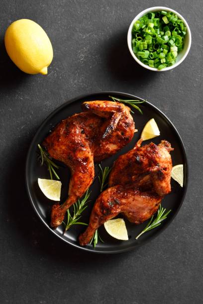 istock Grilled half chicken with lemon and rosemary 2149079979