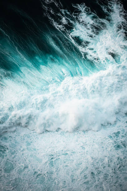 istock Ocean waves crashing, abstract pattern, top down aerial drone view. 2149080590