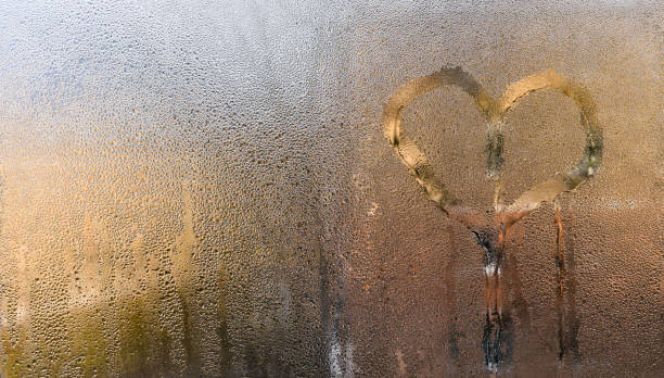istock a heart on wet glass. 2149080600