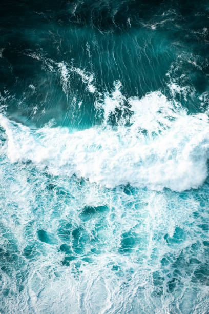 istock Ocean waves crashing, abstract pattern, top down aerial drone view. 2149080661