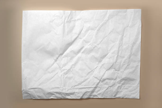 istock White crumpled paper isolated on brown background 2149081020