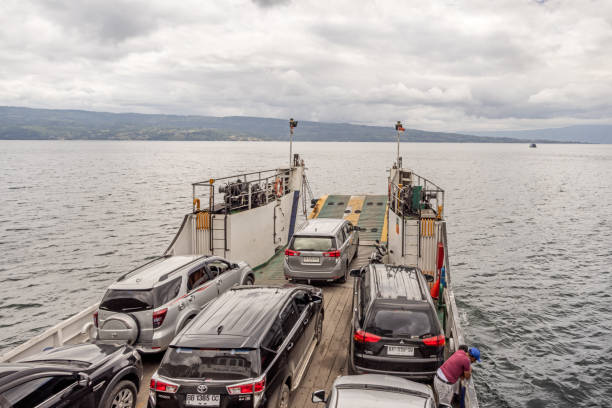 Lake Toba, North Sumatra, Indonesia - January 28th 2024:  Ferry on the large volcanic lake approaching the island Samosir