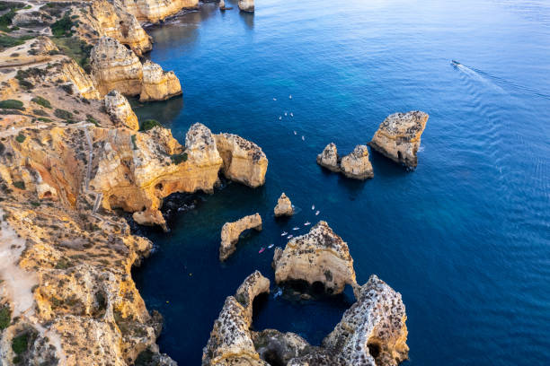 istock Sunrise over Ponta de Piedade, Algarve cliffs on coastline. Aerial drone view 2149082850