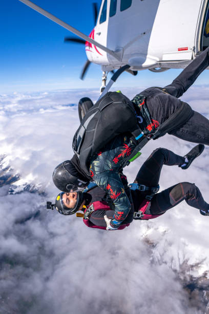 istock Freefall jumpers jump out of plane 2149083157