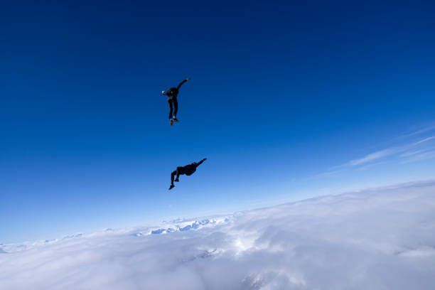 istock Freefall jumpers face each other mid-air 2149083623