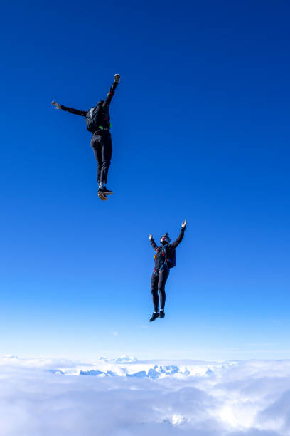 istock Freefall jumpers face each other mid-air 2149083632