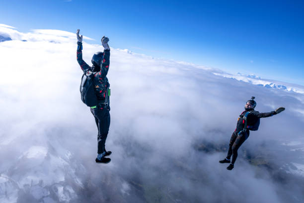 istock Freefall jumpers face each other mid-air 2149083690
