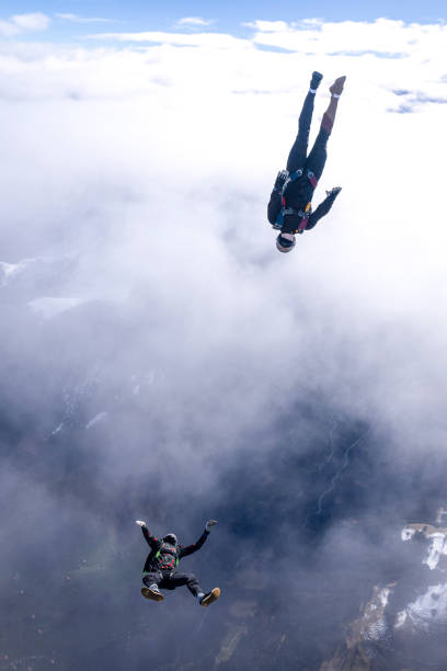 istock Freefall jumpers face each other mid-air 2149083716
